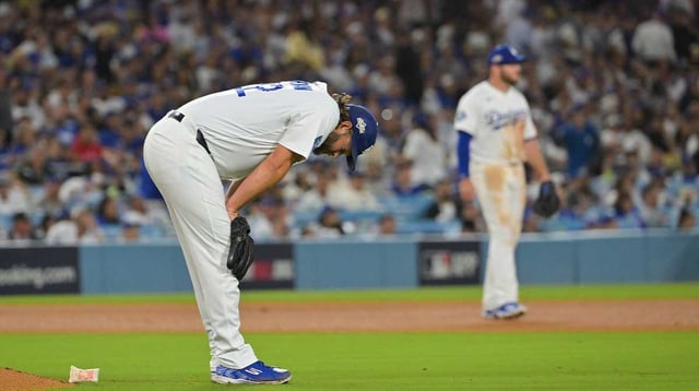 Oct 8, 2025; Los Angeles, California, USA; Los Angeles Dodgers pitcher Clayton Kershaw (22) reacts after giving up a home run during the eighth inning against the Philadelphia Phillies during game three of the NLDS round for the 2025 MLB playoffs at Dodger Stadium. Mandatory Credit: Jayne Kamin-Oncea-Imagn Images