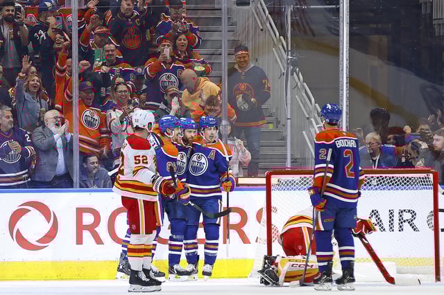 Oct 8, 2025; Edmonton, Alberta, CAN; The Edmonton Oilers celebrate a goal scored by forward Leon Draisaitl (29) during the second period, his 400th career goal against the Calgary Flames at Rogers Place. Mandatory Credit: Perry Nelson-Imagn Images