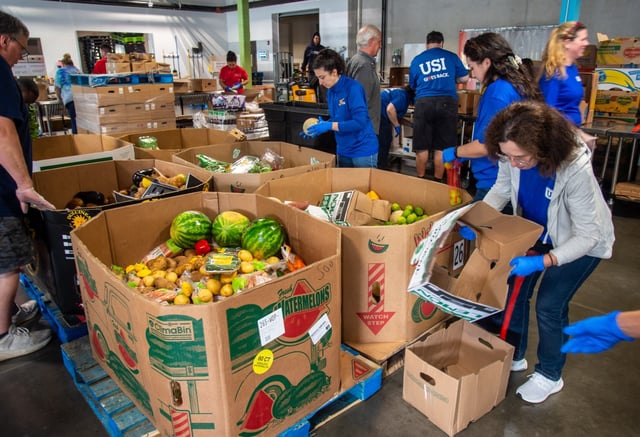 Volunteers from Philip Morris International US, USI Insurance Services, Liberty Bank and regular volunteers pack food for distribution by Connecticut Foodshare’s mobile pantries, Tuesday, Sept. 16, 2025. Philip Morris International US donated $100,000 to Connecticut Foodshare in recognition of Hunger Action Month. Connecticut Foodshare provides food to at least one pantry in each of Connecticut’s 169 towns and cities. “Because of our efficiency and our volunteer force here, every dollar donated we can turn into two meals, so $100,000 is great — 200,000 meals is even better,” said Jason Jakubowski, president and CEO of Connecticut Foodshare. (Aaron Flaum/Hartford Courant)