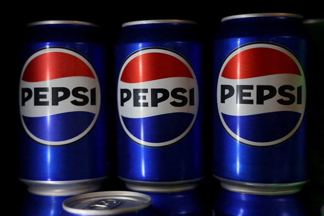 Cans of Pepsi are seen at the PepsiCo Walkers factory in Leicester, Britain, August 14, 2024. REUTERS/Hollie Adams/File Photo