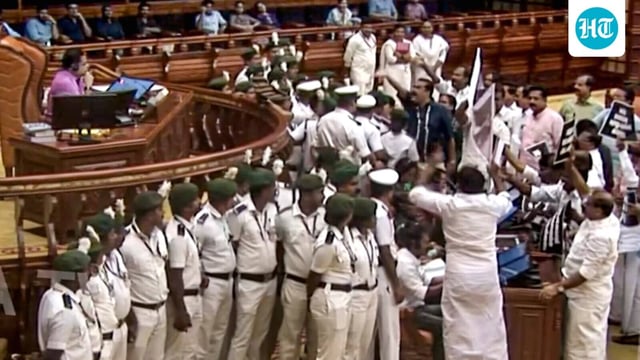 Opposition leaders hold a protest over the Sabarimala gold plating controversy in the Kerala Legislative Assembly in Thiruvananthapuram on Wednesday.