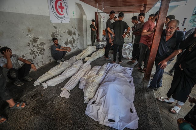 The bodies of Palestinians killed in an Israeli strike on Gaza City are brought to Al-Ahli Baptist Hospital for funeral procedures on Oct. 1, 2025. (Hamza Z. H. Qraiqea/Anadolu via Getty Images)