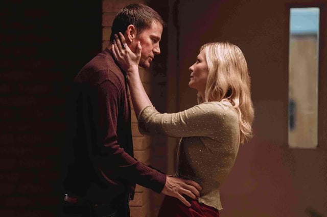 Channing Tatum, left, and Kirsten Dunst in a scene from “Roofman.”