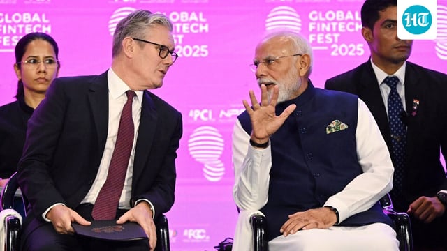 British Prime Minister Keir Starmer, left, and Prime Minister Narendra Modi having a chat.