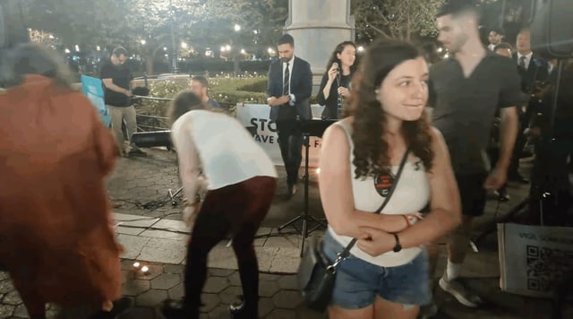 NYC mayoral candidate Zohran Mamdani places a lit candle at a vigil held by Israelis for Peace to mark the second anniversary of the Oct. 7 attack on Israel that began the Israel-Hamas war. (Screenshot)