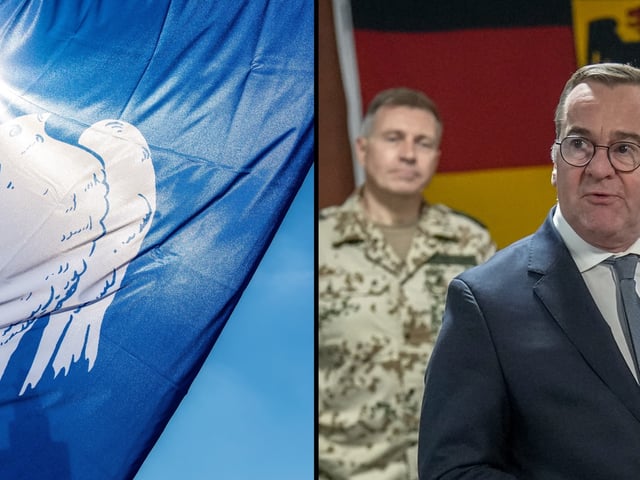 Fahne mit Taube als Friedenssymbol, Verteidigungsminister Boris Pistorius (SPD) im Kreis deutscher Soldaten