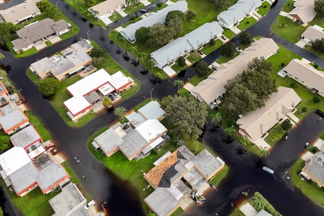 FILE - Waters rise in Pasco County neighborhoods as intense rain from Hurricane Milton caused the Anclote River to flood Oct. 11, 2024, in New Port Richey, Fla. (AP Photo/Mike Carlson, File)