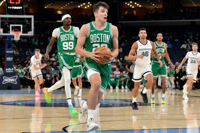 Boston Celtics guard Hugo Gonzalez drives to the basket in the second half of an NBA basketball preseason game against the Memphis Grizzlies, Wednesday, Oct. 8, 2025, in Memphis, Tenn. (AP Photo/Brandon Dill)