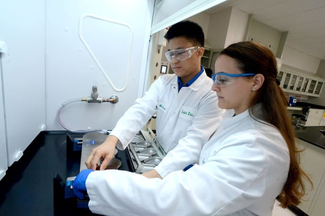 Scientists Michael Tse and Linda DeLaPaz check equipment in a new research lab at Lupin Pharmaceuticals in Coral Springs.