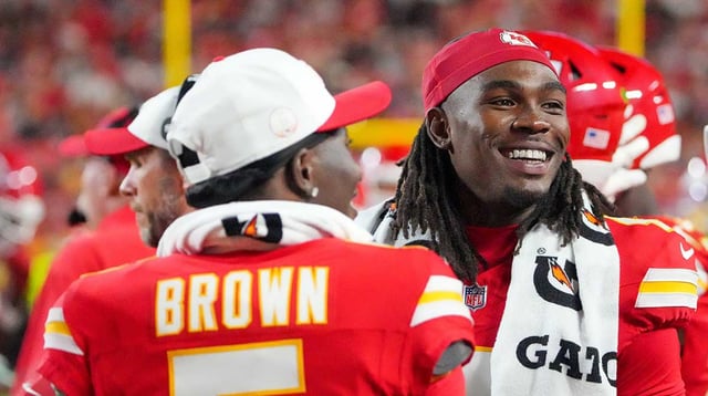Aug 22, 2025; Kansas City, Missouri, USA; Kansas City Chiefs wide receiver Hollywood Brown (5) and wide receiver Rashee Rice (4) laugh on the sidelines against the Chicago Bears during the game at GEHA Field at Arrowhead Stadium. Mandatory Credit: Denny Medley-Imagn Images.