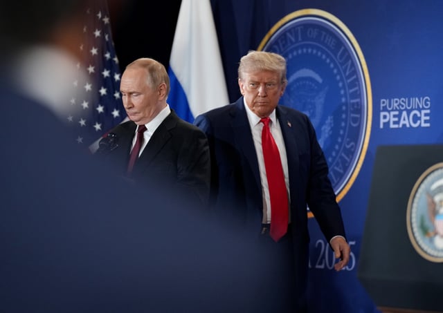 ANCHORAGE, ALASKA - AUGUST 15: U.S. President Donald Trump (R) and Russian President Vladimir Putin arrive for a press conference at Joint Base Elmendorf-Richardson on August 15, 2025 in Anchorage, Alaska. The two leaders are meeting for peace talks aimed at ending the war in Ukraine. (Photo by Andrew Harnik/Getty Images)
