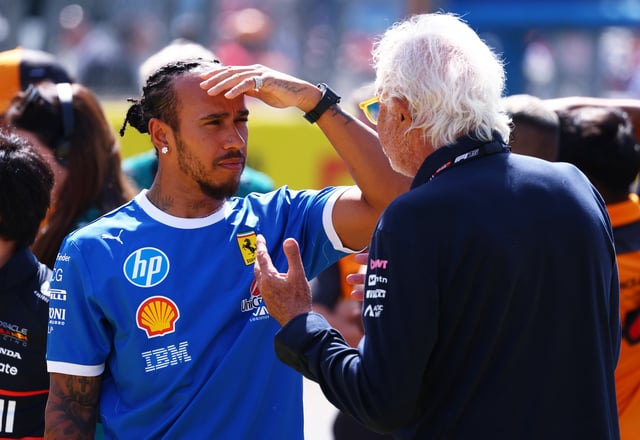 MONZA, ITALY - SEPTEMBER 07: Lewis Hamilton of Great Britain and Scuderia Ferrari and Flavio Briatore, Executive Advisor of Alpine F1 talk on the drivers parade prior to the F1 Grand Prix of Italy at Autodromo Nazionale Monza on September 07, 2025 in Monza, Italy. (Photo by Clive Rose/Getty Images)