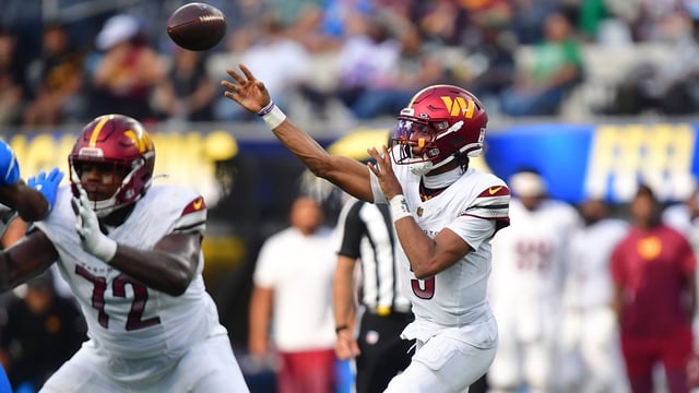 Oct 5, 2025; Inglewood, California, USA; Washington Commanders quarterback Jayden Daniels (5) throws a pass against the Los Angeles Chargers in the second half at SoFi Stadium. Mandatory Credit: Gary A. Vasquez-Imagn Images