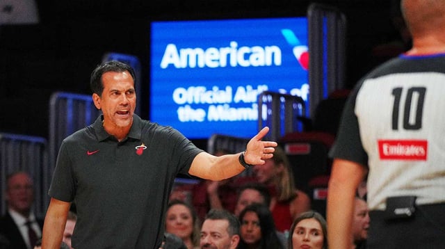 Oct 8, 2025; Miami, Florida, USA; Miami Heat head coach Erik Spoelstra has a few words with the officials over a call during the first half of the game against the San Antonio Spurs at Kaseya Center. Mandatory Credit: Jim Rassol-Imagn Images
