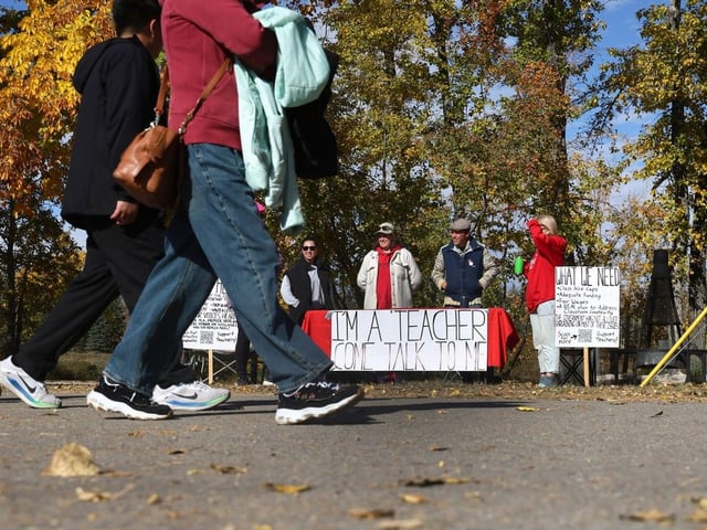 Teachers from Robert Thirsk High School set up at Bowness Park to engage parents on their needs and how to help them during the teachers strike  in Calgary on Wednesday.