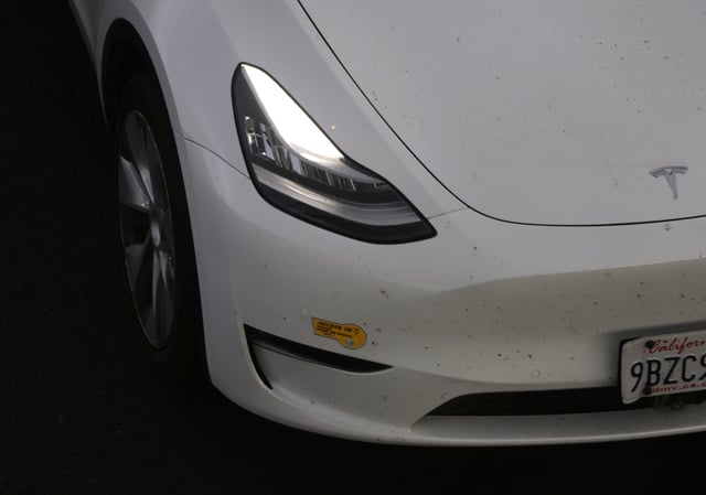 A Tesla car with California Clean Air Vehicle decals drives in the high occupancy vehicle (HOV) lane on Interstate 80 on September 30, 2025 in Berkeley, California.