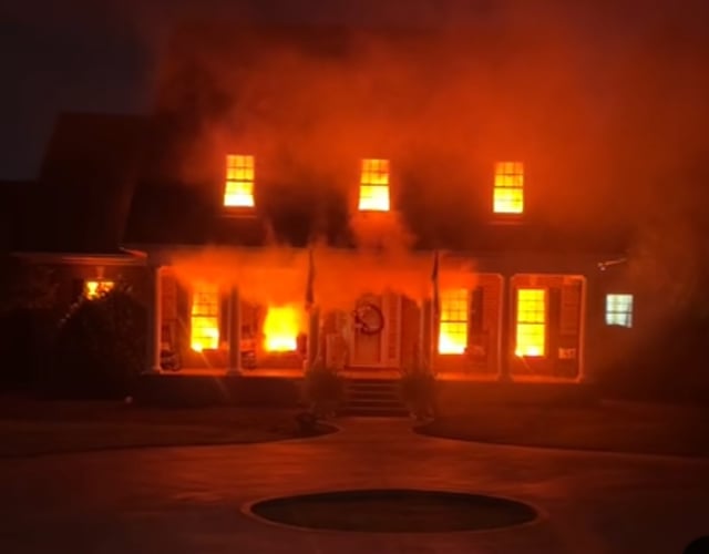 Sam Lee and Amanda Riggins Peden's Halloween decorations   mimicking a house fire.