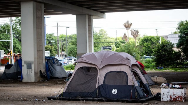 A tent encampment for people experiencing homelessness underneath a US 290 overpass in south Austin, TX on June 2, 2021.  Gabriel C. Pérez/KUT News