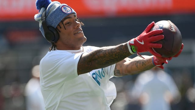Sep 28, 2025; Foxborough, Massachusetts, USA; New England Patriots cornerback Christian Gonzalez (0) catches the ball during warmups prior to a game against the Carolina Panthers at Gillette Stadium. Mandatory Credit: Bob DeChiara-Imagn Images