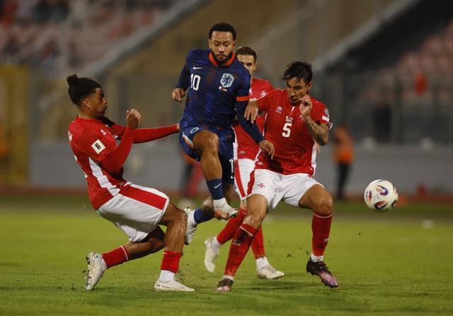 Soccer Football - FIFA World Cup - UEFA Qualifiers - Group G - Malta v Netherlands - National Stadium Ta' Qali, Attard, Malta - October 9, 2025 Netherlands' Memphis Depay in action with Malta's Kurt Shaw REUTERS/Darrin Zammit Lupi
