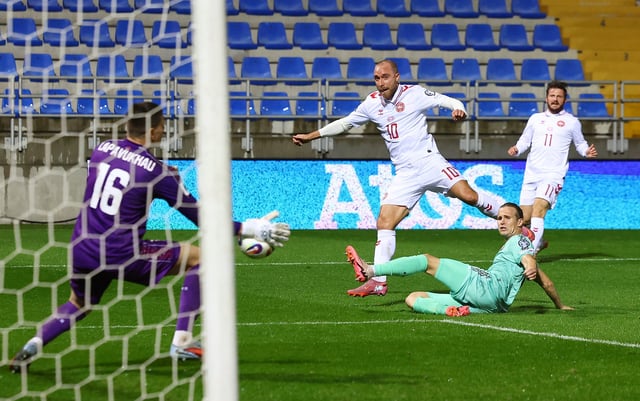 Soccer Football - FIFA World Cup - UEFA Qualifiers - Group C - Belarus v Denmark - ZTE Arena, Zalaegerszeg, Hungary - October 9, 2025 Belarus' Fedor Lapoukhov and Kirill Pechenin in action with Denmark's Christian Eriksen REUTERS/Bernadett Szabo