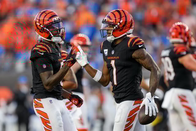 CINCINNATI, OHIO - OCTOBER 05: Tee Higgins #5 and Ja'Marr Chase #1 of the Cincinnati Bengals celebrate after Chase scored a touchdown during the fourth quarter against the Detroit Lions at Paycor Stadium on October 05, 2025 in Cincinnati, Ohio. (Photo by Dylan Buell/Getty Images)