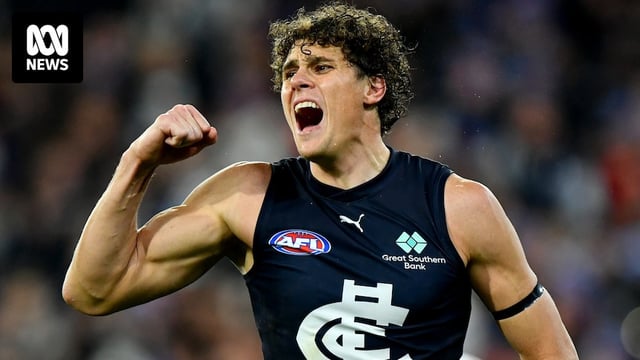 Charlie Curnow pumps his right fist during Carlton's AFL win over Essendon.