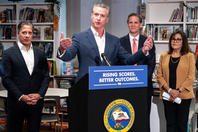 CA Governor Gavin Newsom speaks to the media during a signing of Bill AB1454 on Thursday, Oct. 9, 2025. In background are, L to R;  LAUSD Superintendent Alberto Carvalho, Marshall Tuck of EdVoice, and Martha Hernandez of California Together.  The bill will increase literary funding to schools.  (Photo by David Crane, Los Angeles Daily News/SCNG)