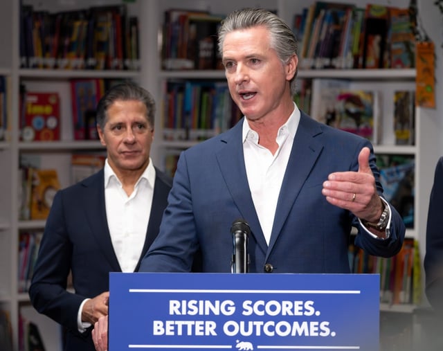CA Governor Gavin Newsom speaks to the media during a signing of Bill AB1454 on Thursday, Oct. 9, 2025.  At right is LAUSD Superintendent Alberto Carvalho.  The bill will increase literary funding to schools.  (Photo by David Crane, Los Angeles Daily News/SCNG)