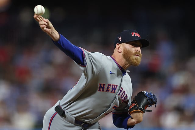 Sep 11, 2025; Philadelphia, Pennsylvania, USA; New York Mets pitcher Reed Garrett (75) shows a pitch against the Philadelphia Phillies during the sixth inning at Citizens Bank Park. Mandatory Credit: Bill Streicher-Imagn Images/ File Photo