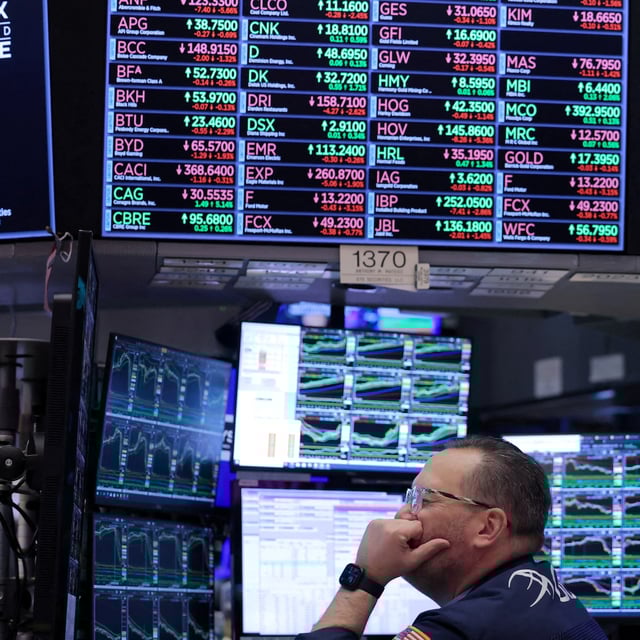 FILE PHOTO: A trader works on the trading floor at the New York Stock Exchange (NYSE) in New York City, U.S., April 4, 2024. REUTERS/Andrew Kelly//File Photo