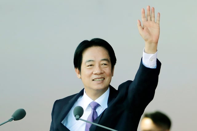 Taiwanese President Lai Ching-te waves during National Day celebrations in front of the Presidential Building in Taipei, Taiwan, Friday, Oct. 10, 2025.