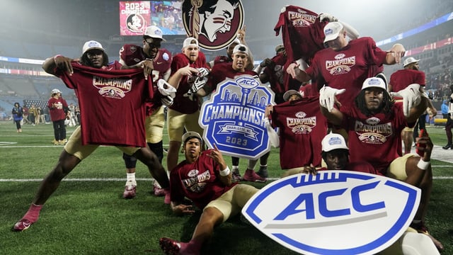 FILE - Florida State players pose after defeating Louisville in the Atlantic Coast Conference championship NCAA college football game Saturday, Dec. 2, 2023, in Charlotte, N.C. Florida State announced it will hold a Board of Trustees meeting on Friday, Dec. 22, and a person with knowledge of the situation told The Associated Press the future of the athletic department and its affiliation with the Atlantic Coast Conference will be discussed.(AP Photo/Erik Verduzco, File)