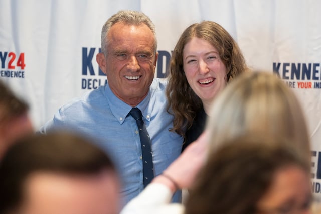 PHOENIX, ARIZONA - DECEMBER 20: Independent Presidential candidate Robert F. Kennedy Jr. takes pictures with a supporter during his campaign rally at Legends Event Center on December 20, 2023 in Phoenix, Arizona. (Photo by Rebecca Noble/Getty Images)