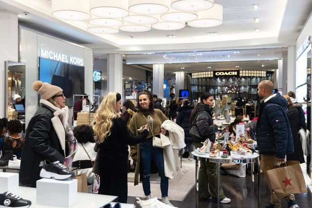 People shop at Macy's in New York on Dec. 23, 2023.