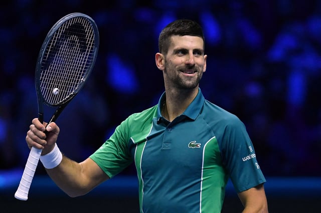 Serbia's Novak Djokovic celebrates after winning his first round-robin match against Denmark's Holger Rune at the ATP Finals tennis tournament in Turin on November 12, 2023.