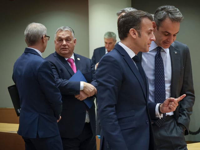 Prime Minister of Hungary Viktor Orbán as seen talking with the Prime Minister of Bulgaria Nikolai Denkov, Prime Minister of Slovenia Robert Golob and Federal Chancellor of Austria Karl Nehammer while President of the Republic of France Emmanuel Macron is talking with Prime Minister of Greece Kyriakos Mitsotakis at the Round Table - Tour de Table meeting room, during the European Council summit with the EU leaders before the official talks and negotiations. European leaders agreed to open EU accession talks with Ukraine and Moldova. Hungary blocks 50bn in EU aid for Ukraine hours after membership talks were approved. Hungary's PM Viktor Orban vetoed the plan of the bloc for extra money to Kyiv. EUCO, Brussels, Belgium on December 14, 2023 (Photo by Nicolas Economou/NurPhoto via Getty Images)