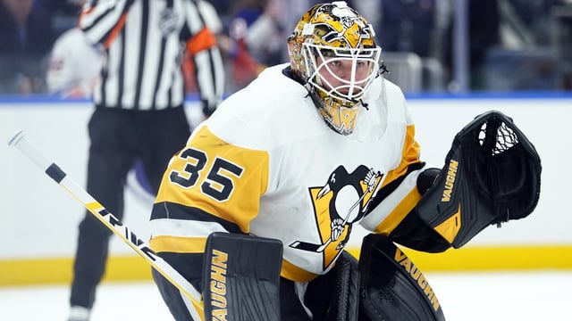 FILE - Pittsburgh Penguins goaltender Tristan Jarry protects his net during the second period of an NHL hockey game against the New York Islanders, Tuesday, Dec. 27, 2022, in Elmont, N.Y. The Pittsburgh Penguins decided to bring back two-time All-Star goaltender Tristan Jarry, signing him Saturday, July 1, 2023 to a $26.875 million, 5-year deal with a $5.375 million annual cap hit through 2028.(AP Photo/Frank Franklin II, File)