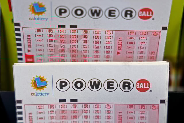 Powerball play slips are displayed in a convenience store on July 18, 2023 in Los Angeles.