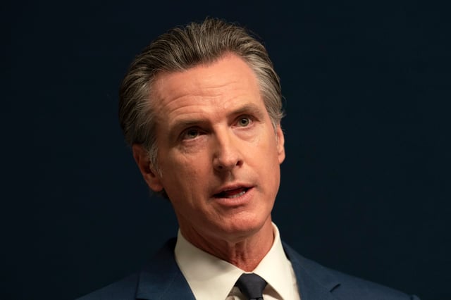 FILE – California Gov. Gavin Newsom answers questions during a news conference, Sept, 26, 2023, in Sacramento, Calif. Newsom, who is often at the center of speculation over his national political ambitions, again seized the spotlight beyond the state’s borders as he signed laws this year to require major companies to disclose their emissions, raise wages for fast-food workers, and prevent school boards from banning books based on gender and race. (AP Photo/Rich Pedroncelli, File)