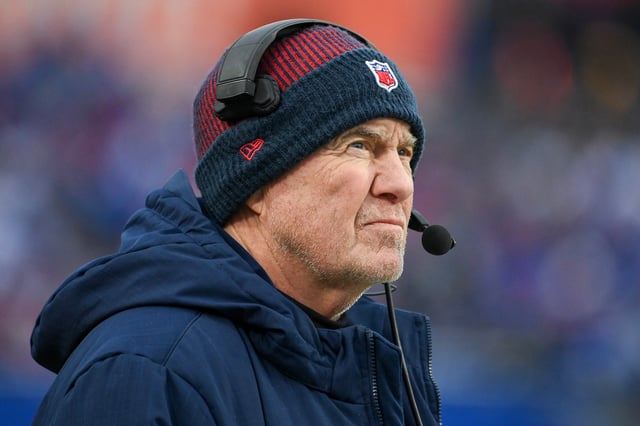 Head coach Bill Belichick of the New England Patriots looks on during the first half of a game against the Buffalo Bills at Highmark Stadium on December 31, 2023 in Orchard Park, New York.