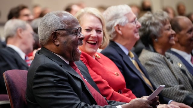 Associate Supreme Court Justice Clarence Thomas sits with his wife and conservative activist Virginia Thomas while he waits to speak at the Heritage Foundation on October 21, 2021 in Washington, DC. (Photo by Drew Angerer/Getty Images)