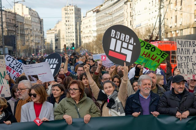 Opposition Protesters march during a rally in downtown Belgrade, Serbia on December 30, 2023. Photo: Associated Press/Alamy