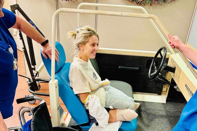 Lucinda Mullins smiles after a rehab session.