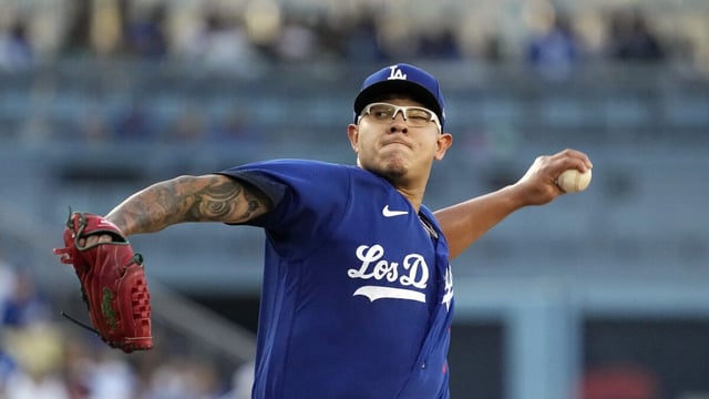 Dodgers starting pitcher Julio Urias leans back and throws to the plate against the Pirates 