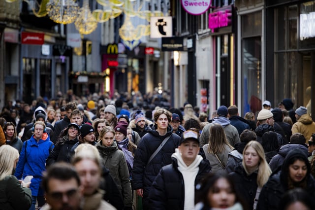 Shoppers walk in a street with shops, in the centre of Amsterdam on December 23, 2023. (Photo by Ramon van Flymen / ANP / AFP) / Netherlands OUT