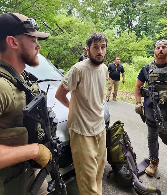Pennsylvania escaped inmate Michael Burham has been captured without incident in a wooded area near Warren, a source with knowledge of the investigation tells CNN.