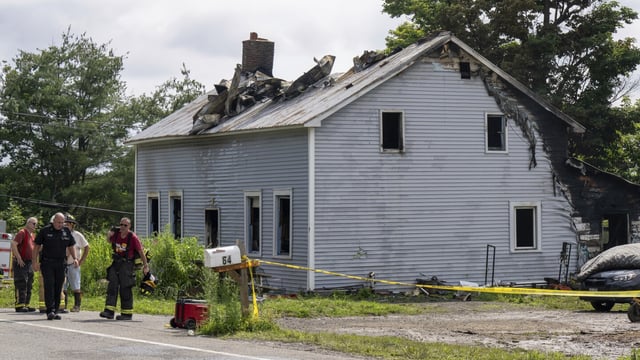 Emergency responders work the scene of a deadly house fire on Saturday, July 8, 2023 in New Scotland, N.Y. Four people died, including a 5-year-old girl, when a fire swept through a house west of Albany, just before sunrise Saturday. (Jim Franco /The Albany Times Union via AP)