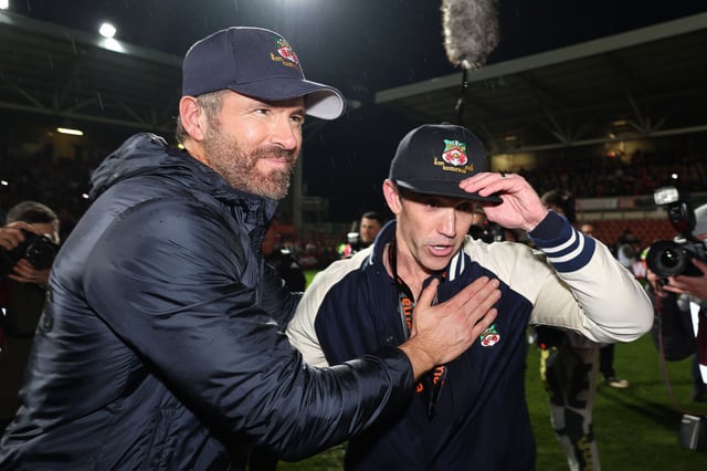 Wrexham owners Ryan Reynolds and Rob McElhenney, seen here at the soccer team's grounds in 2023, celebrated Wrexham's win in an FA Cup game on Jan. 7.