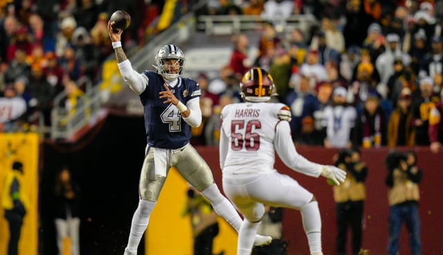 Dallas Cowboys quarterback Dak Prescott (4) throwing the ball over Washington Commanders defensive end Jalen Harris (56) looks on during the first half of an NFL football game, Sunday, Jan. 7, 2024, in Landover, Md. (AP Photo/Jessica Rapfogel)